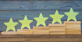 PME Top 20 Products of 2023 feature image of five wooden stars on the ladder upgrade rating of side-by-side stacked wooden blocks.