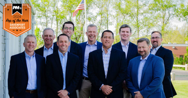 Davenport Associates' leadership team poses for a photo outside their building.