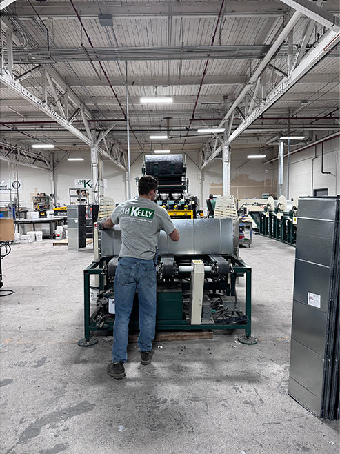 JH Kelly employee in fabrication and module warehouse.