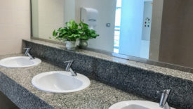 oilet interior with white sink and faucet