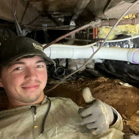 Tucker Baney with his thumbs up at work.