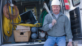 Plumber with his tools in a truck.