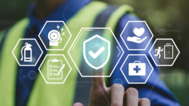 Floating white work safety icons, a blurred background of a worker in a safety vest pressing on the center icon.