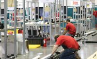 Plumbing Apprentices Measure Black Pipe